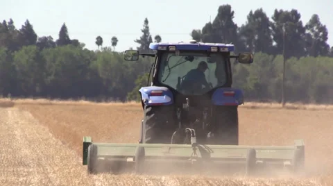Farmer mowing field Stock Footage 28834564