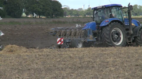 Farmer plowing field - HD Stock Footage 27842317