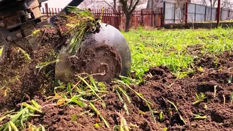 Farmer plowing spring soil Stock Footage 152854348