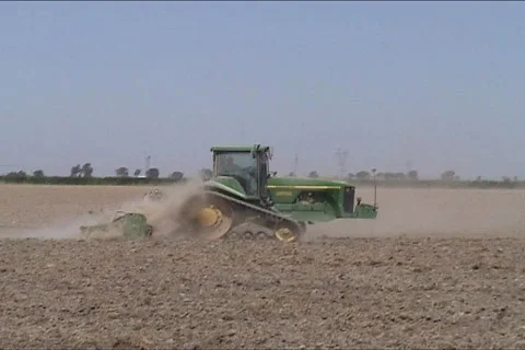 Farmer plowing with tractor Stock Footage 116895