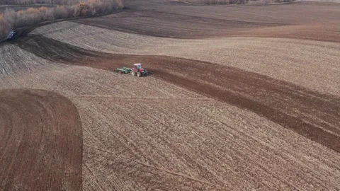 Farmer plows a field, preparing land for sowing. Stock Footage 130349231
