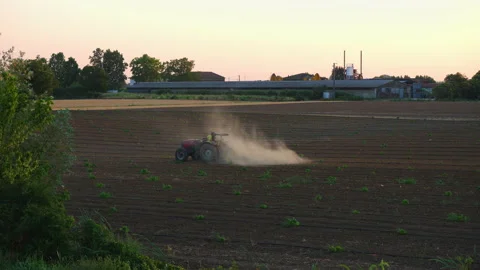 Farmer plows the fields with tractor Stock Footage 199960166