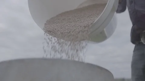 Farmer pouring pig feed Stock Footage 73845804