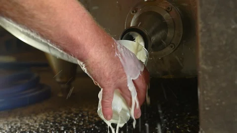 Farmer pouring raw unpasteurized milk into glass. Stock Footage 87641650