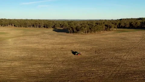 Farmer preparing his crops with a tractor in Australia Stock Footage 150225810
