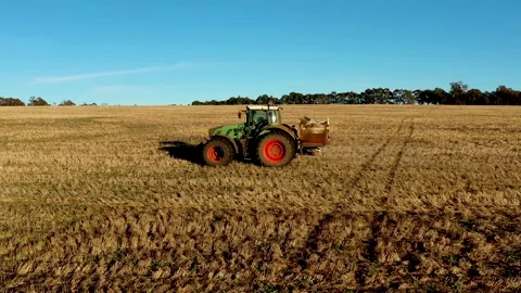 Farmer preparing his crops with a tractor in Australia Stock Footage 150225818