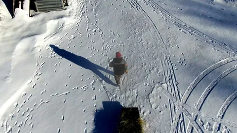 Farmer Pulling Bail of Hay on Sled Stock Footage 122858924