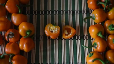 Farmer putting sliced peppers on table Stock Footage 259368279