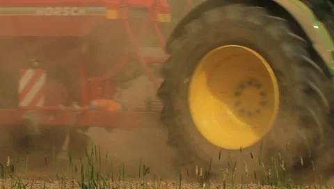 Farmer seeding corn on a dry dusty field Stock Footage 11061118
