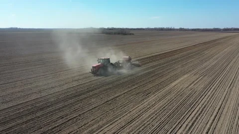 Farmer seeding crops at field. Seeding Aerial View. Stock-Footage 128276493