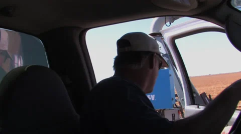 Farmer sets spray timer Stock Footage 27575098