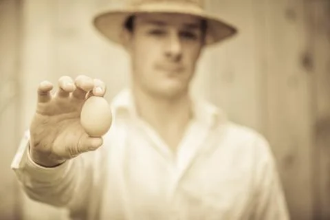 Farmer Showing an Egg Stock Photos