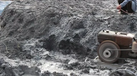Farmer on a small tractor to plow a field in spring day Stock-Footage 49715094