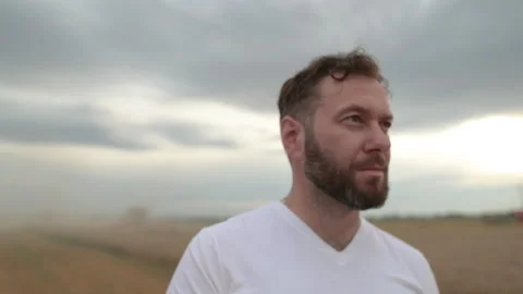 A farmer with a tablet for taking notes stands Stock Footage 250952230