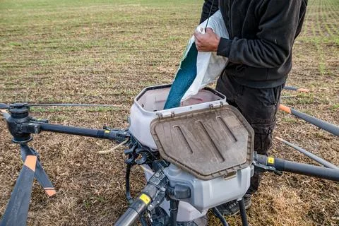 Farmer technicians prepare to remotely fly agricultural drones to fly to sp.. Stock Photos