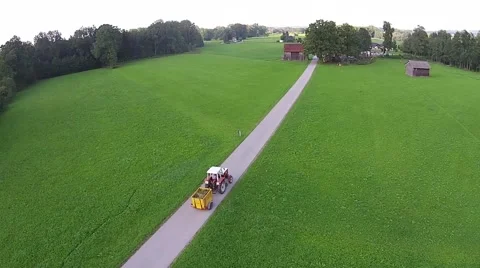 Farmer with tractor, field green meadow sunny day. Stock Footage 47011272