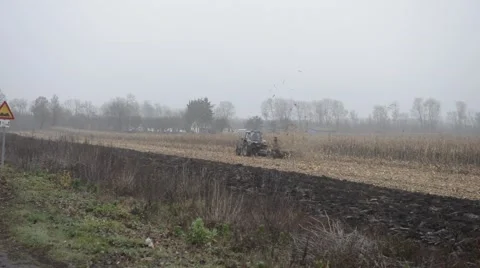 Farmer on a Tractor Stockbeeldmateriaal 48633287