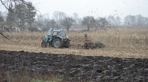 Farmer on a Tractor Stockbeeldmateriaal 48633423