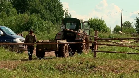 The farmer on the tractor goes to work Stock-Footage 70716794