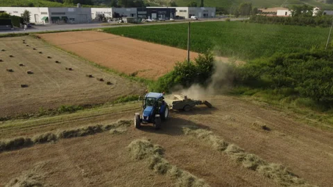 Farmer with Tractor Machine Working on Hay Bales in Agriculture Wheat Field 스톡 동영상 202320272