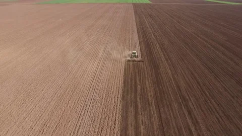 Farmer in tractor preparing land with seedbed cultivator Stock Footage 72595202