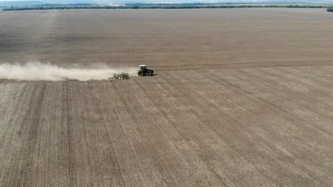 Farmer in tractor preparing land with seedbed cultivator Stock Footage 127597906