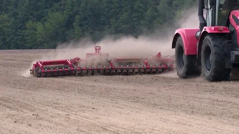 Farmer in tractor preparing land with seedbed cultivator Video stock 296087077