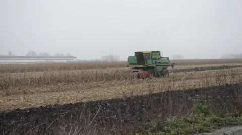 A Farmer on The Tractor Processes The Earth Stock Footage 48633458
