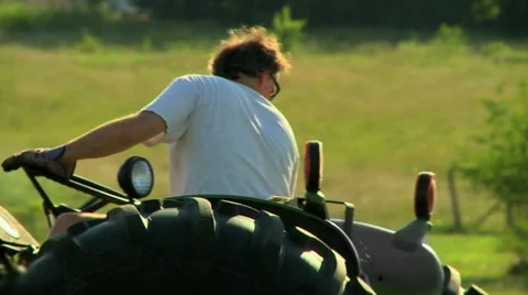 Farmer tractor reverse Stock Footage 12164489