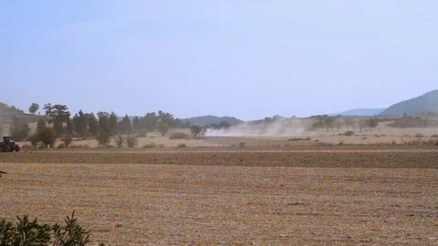Farmer with tractor seeding and preparing field for crop Stock Footage 93163195