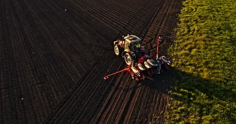 Farmer in tractor seeding corn maize at ... | Stock Video | Pond5