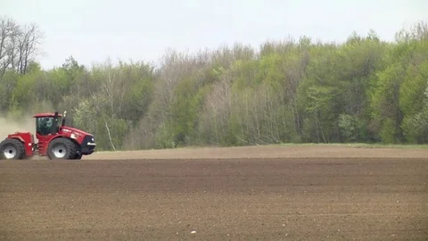 Farmer with tractor seeding Stock Footage 85327214