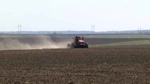Farmer with tractor seeding Stock Footage 87608204