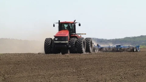 Farmer with tractor seeding Stock Footage 87608249