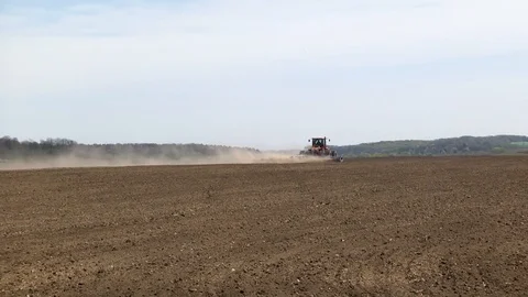 Farmer with tractor seeding Stock Footage 87608276