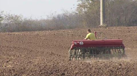 Farmer in tractor sows wheat 스톡 동영상 56706439