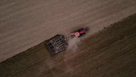Farmer with tractor tilling the field to open the soil Stock Footage 138968129