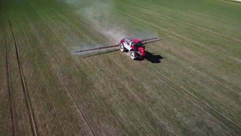 Farmer tractor working in field. Farmer sprays toxic chemicals on farmland Video stock 278281863