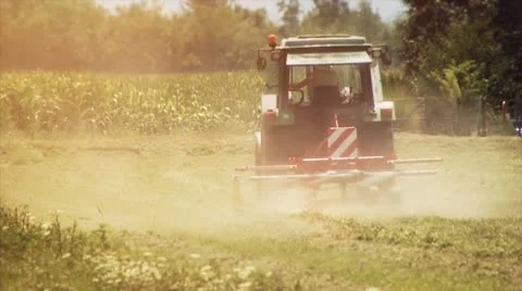Farmer with tractor working on the meadow Video stock 10575572