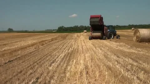 Farmer Unloads Hay Bale Video stock 12579148