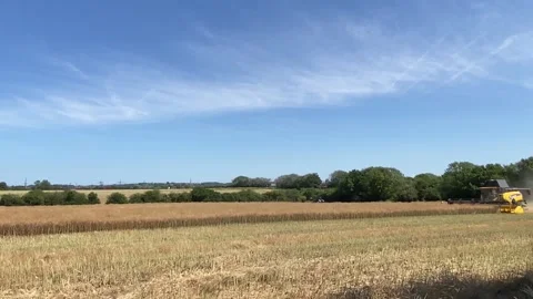 Farmer using a New Holland CX890 combine harvester to reap the fields. Stock Footage 338325724