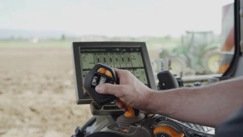 A farmer using a tractor to prepare the fields for Stock Footage 265291048