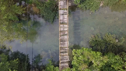 A farmer is walking at broken bridge Stock Footage 113847597