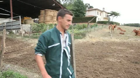 Farmer walking outside the barn Video stock 14833871