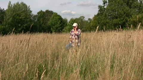 Farmer walking talking in a cellphone Stock Footage 545091