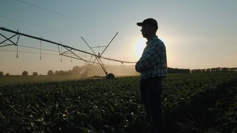 Farmer watching the irrigation cornfield Stock Footage 110912651
