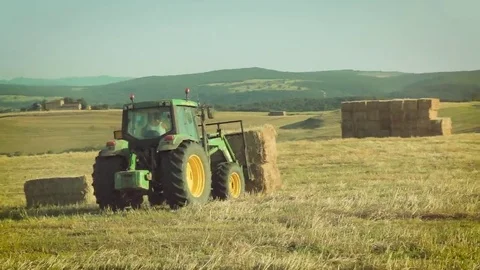 Farmer at work in the fields with the tractor Stock Footage 69212942