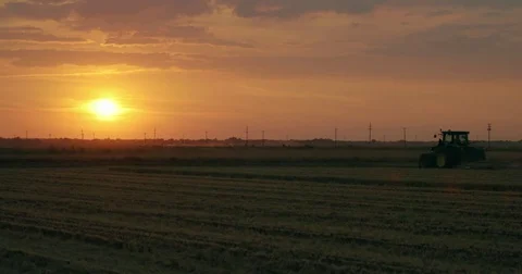 Farmer working the fields during morning sunrise everning sunset american proud Stock Footage 78951854