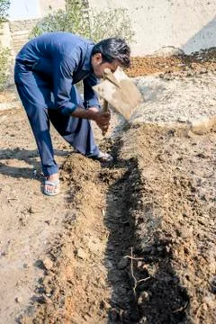 Farmer is working in the fields Stock Photos