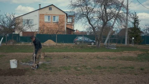 A farmer working in his garden. Stock Footage 89450880